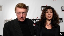 FILE - Writer, director Larry Cohen, left, and wife Cynthia Cohen arriving for the Comcast, Sony and Lionsgate launch party for FEARnet, a multi-platform network dedicated to horror, held at the Boulevard 3 nightclub in Los Angeles, Oct. 30, 2006. 