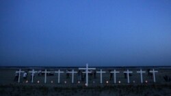 Eleven crosses represent the workers who died in the Deepwater Horizon oil rig explosion