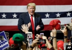 FILE - President Donald Trump acknowledges the crowd at a rally in Chattanooga, Tenn., Nov. 4, 2018.