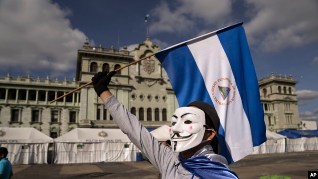A Nicaraguan citizen protests against President Daniel Ortega at the Constitution Square in Guatemala City, Nov. 7, 2021.