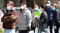 People wait to be tested for a coronavirus outside a hospital in Sarajevo, April 6, 2020