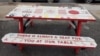 The message on this table in Wolfville, Nova Scotia, aligns with the town's attitude toward helping refugees. A community group from Wolfville has been among those in Canada to take primary responsibility for helping refugees become established in the country. (Wikimedia Commons)