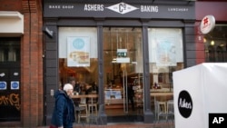 FILE- In this March 26, 2015, photo, the store front of Ashers Baking Company is seen in Belfast, Northern Ireland. On Monday, Ashers lost its appeal against a 2015 court ruling that the business discriminated against a homosexual customer by refusing to