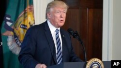 FILE - President Donald Trump speaks at the Treasury Department in Washington, April 21, 2017.