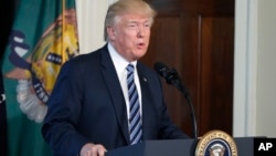 FILE - President Donald Trump speaks at the Treasury Department in Washington, April 21, 2017.