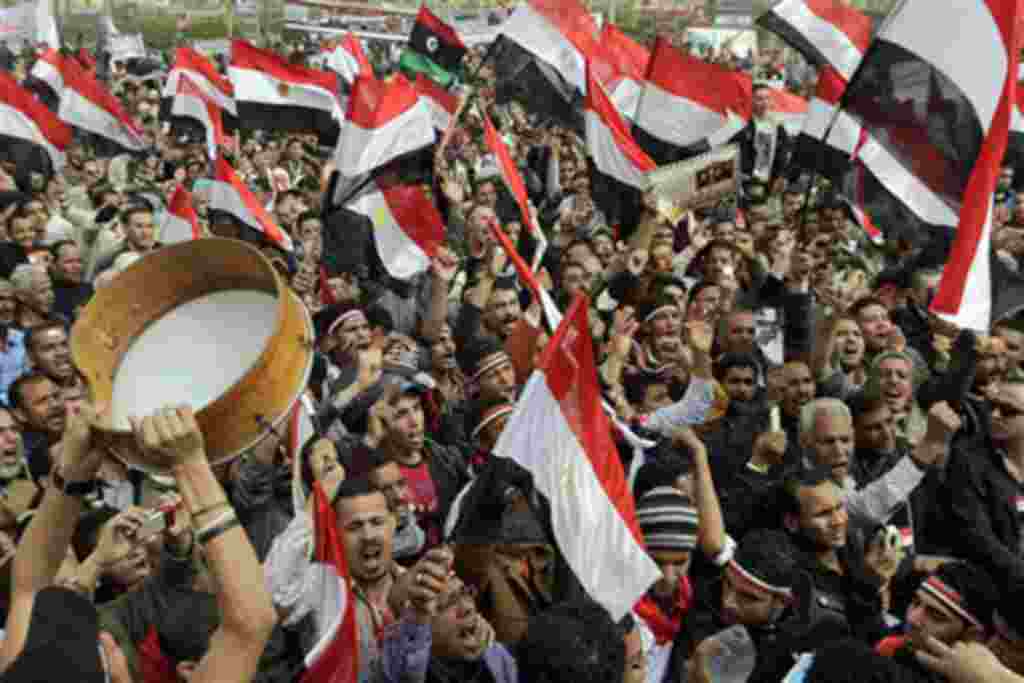 Thousands of Egyptians shout slogans as they gather at Tahrir Square, the focal point of the Egyptian uprising, in Cairo, Egypt, February 25, 2011