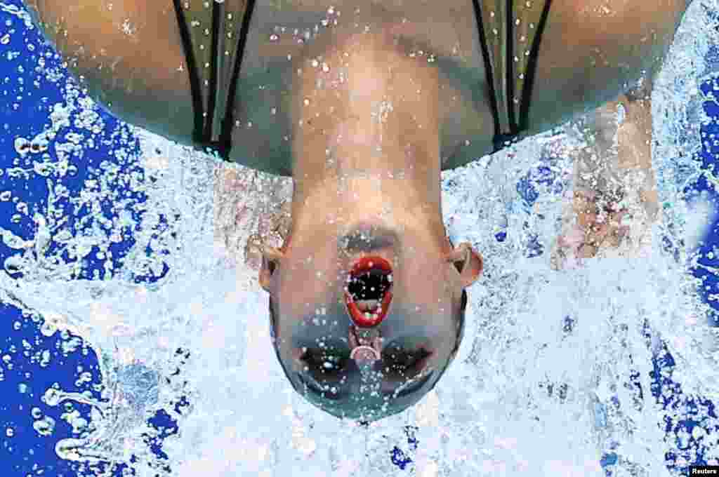 A member of the French duet performs during the women&#39;s duet free routine final of artistic swimming at the Tokyo Aquatics Center in Tokyo, Japan.