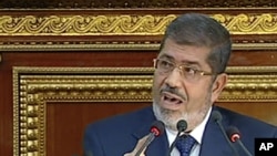 FILE - Egyptian President Mohammed Morsi, December 29, 2012.