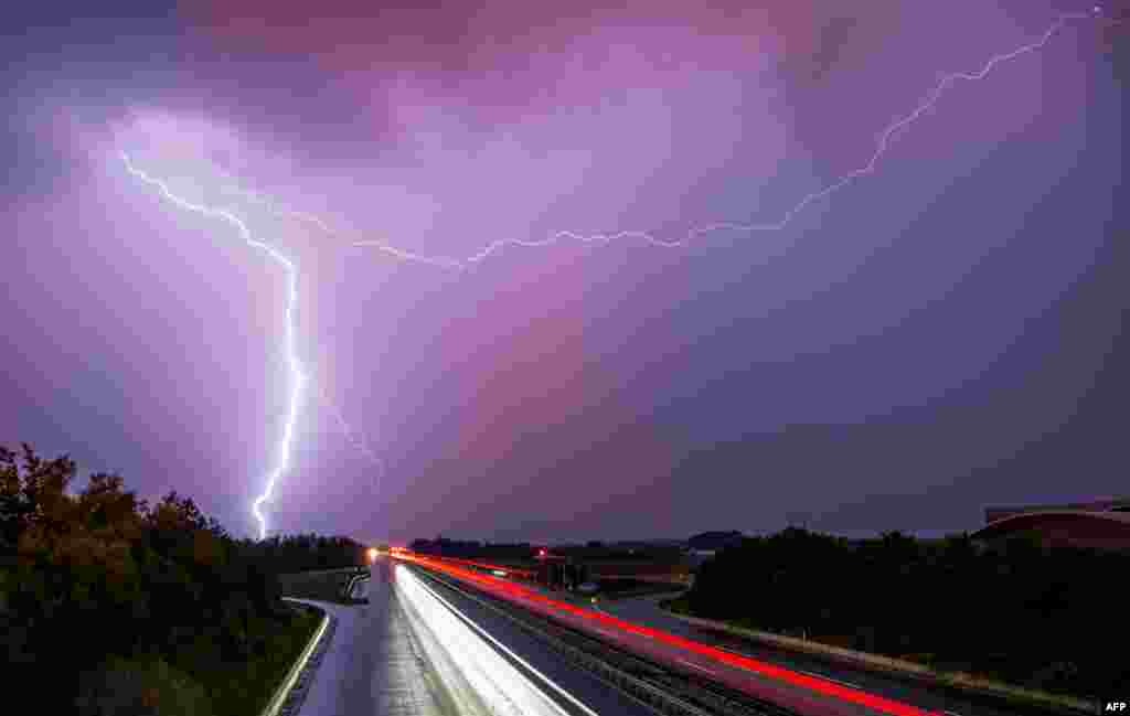 Lightning flashes through the sky over the A9 highway near Allershausen, southern Germany.