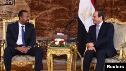 Egyptian President Abdel Fattah al-Sissi, right, meets with Ethiopian Prime Minister Abiy Ahmed at the Ittihadiya presidential palace in Cairo, Egypt, June 10, 2018.