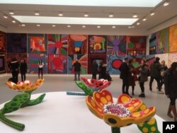 A large-scale flower sculpture created by Japanese artist Yayoi Kusama, part of the exhibit, "Yayoi Kusama: Festival of Life," is displayed at the David Zwirner gallery in the Chelsea section of New York, Nov. 21, 2017.