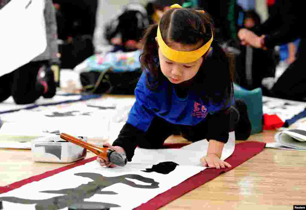 A girl participates in a New Year calligraphy contest in Tokyo, Japan, Jan. 5, 2019.