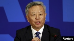 FILE - President of Asian Infrastructure Investment Bank (AIIB) Jin Liqun speaks at a news conference in Beijing.