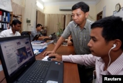 FILE - Voice of Democracy's news website is seen on a computer screen in an office in Phnom Penh, Cambodia, Aug. 31, 2017.