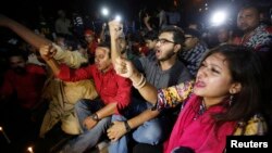 People chant slogans as they attend a sit-in protest at Shahbagh intersection demanding capital punishment for Bangladesh's Jamaat-e-Islami senior leader Abdul Quader Mollah after he won a dramatic stay of execution before he was due to be hanged in Dhaka
