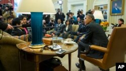 President Barack Obama meets with a group of "Dreamers" in the Oval Office of the White House in Washington, Feb. 4, 2015.