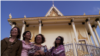 The three survivors, along with a Cambodian American professor Leakhena Nov, at the temple. (Courtesy Photo​ of Michael Siv)