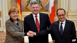 Ангела Меркель, Петр Порошенко и Франсуа Олланд. Киев, Украина. 5 февраля 2015 г.