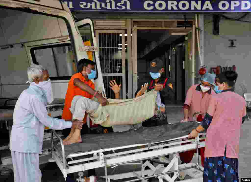 Jagdishbhai Himmatbhai Solanki, with a breathing problem, is wheeled into a COVID-19 hospital for treatment during the ongoing COVID-19 outbreak in Ahmedabad, India.