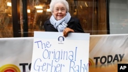 FILE - Ann Turner Cook, whose baby face launched the iconic Gerber logo, arrives at NBC’s Today Show, Nov. 6, 2012, in New York City.