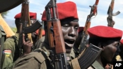 Government soldiers follow orders to raise their guns during a military parade in Juba, South Sudan. (File)