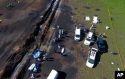 Forenses trabajan en el área de la explosión de un oleoducto roto por ladrones en Tlahuelilpan, Hidalgo, México. Sábado 19 de enero de 2019.