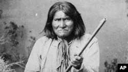 The famed Indian warrior Geronimo, a Chiricahua Apache, posing with a rifle in 1887