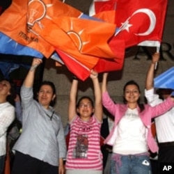 Supporters celebrate Erdogan's Justice and Development Party winning a third term in elections this year, Ankara, June 12, 2011.