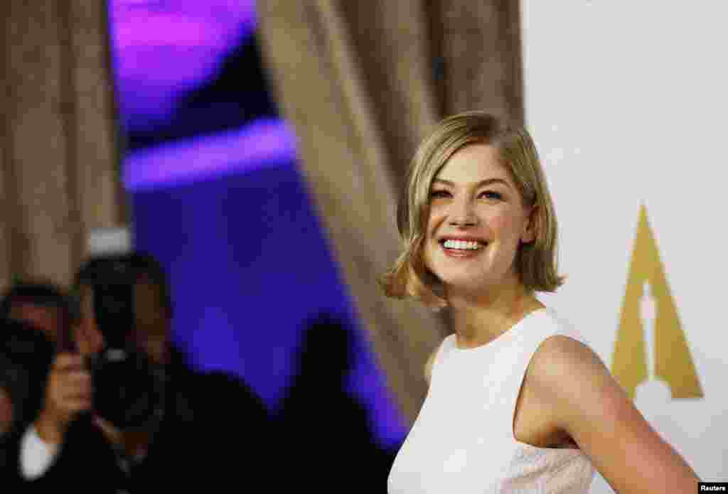 Rosamund Pike, Best Actress nominee for her role in the film "Gone Girl," arrives at the 87th Academy Awards nominees luncheon in Beverly Hills, California, Feb. 2, 2015. 