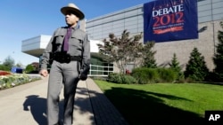 FILE – A New York state trooper stands outside the site of a debate between President Barack Obama and the Republican presidential nominee, former Massachusetts Gov. Mitt Romney, at Hofstra University's David S. Mack Sports Complex in Hempstead, New York.