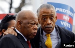 U.S. Rep. John Lewis (L) and the Rev. Al Sharpton confer during a voter's rights rally in front of the U.S. Supreme Court in Washington, Feb. 27, 2013.