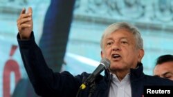 FILE - Mexico's President-elect Andres Manuel Lopez Obrador talks to supporters in Monterrey, Oct. 19, 2018. 