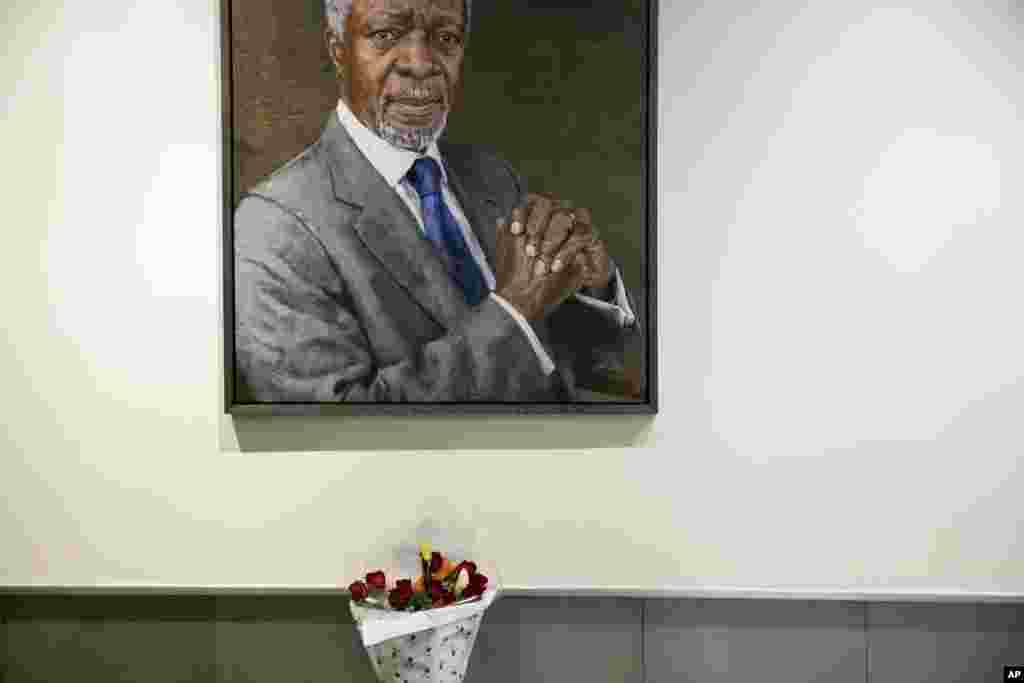 A bouquet of flowers is placed near the portrait of former United Nations Secretary-General Kofi Annan at U.N. headquarters, Aug. 18, 2018. Annan, one of the world&#39;s most celebrated diplomats and a charismatic symbol of the United Nations who rose through its ranks to become the first black African secretary-general, has died. He was 80.