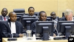 Back row, former Kenyan Education Minister Ruto, left, former Kenyan Minister of Industrialization Kosgey, center, and Kenyan broadcaster Sang, right, appear at the International Criminal Court in The Hague, Netherlands, April 7, 2011