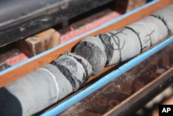 This March 1, 2017 photo, shows sections of a rock core extracted during a geological research project in the al-Hajjar mountains of Oman.