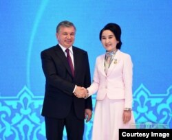 President Mirziyoyev with Zulfiya award recipient, Tashkent, March 7, 2018. Zulfiya is a state award given to girls for success and contribution in science, arts and sports.