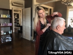 Hair stylist Ashley Holland said the new minimum wage might lead to more clients who can afford her services, but she also worries the increase might affect other local businesses – some already struggling to get by – and their ability to pay their employees.