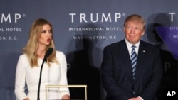 FILE - Republican presidential candidate Donald Trump listens as his daughter Ivanka Trump speaks during the grand opening of Trump International Hotel in Washington.