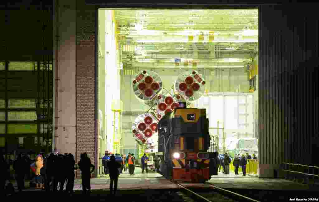 The Soyuz TMA-19M spacecraft is rolled out by train to the launch pad at the Baikonur Cosmodrome in Kazakhstan.