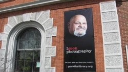 The Rutland Free Library features a large poster of popular local hotdog vendor Lenny Montuori as part of the "Geek the Library" campaign in Rutland, Vermont.