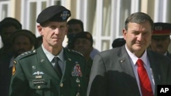 General Stanley McChrystal, left, with Ambassador Karl Eikenberry at a memorial ceremony in Kabul last fall