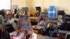 Second-graders in Alieu Samb primary school hold up chalk boards with French conjugations. Dakar, Senegal, Dec. 7 2017. (Photo: Sofia Christensen for VOA) 