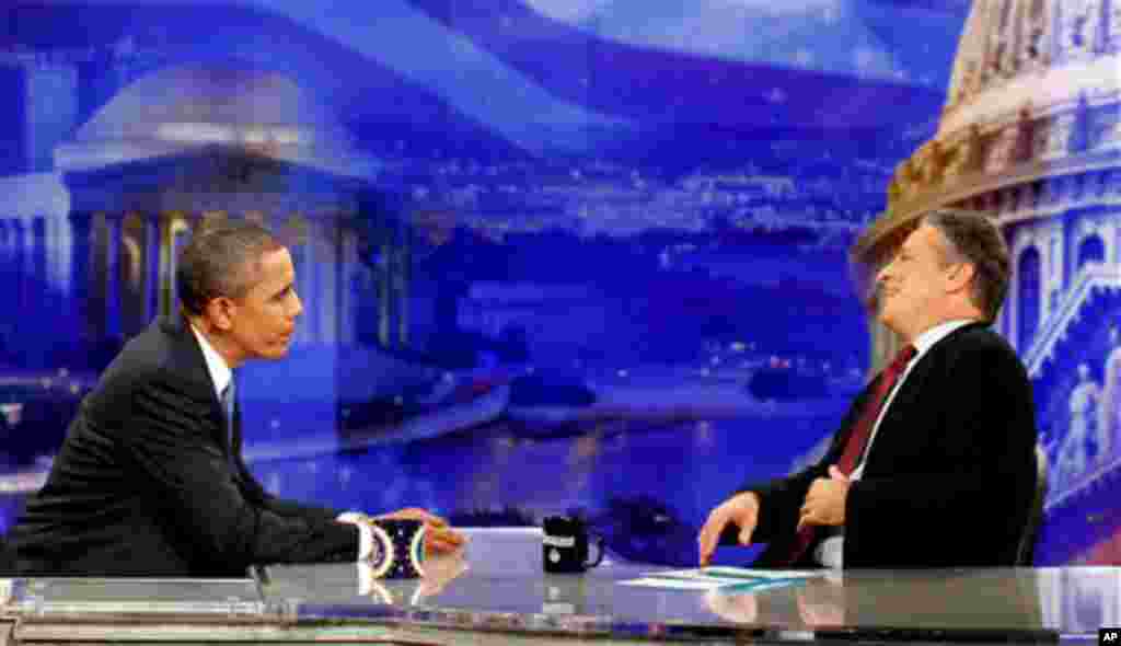 President Barack Obama is pictured during a commercial break as he talks with host Jon Stewart as he takes part in a taping of Comedy Central's The Daily Show with Jon Stewart, Wednesday, Oct. 27, 2010, in Washington. (AP Photo/Charles Dharapak)