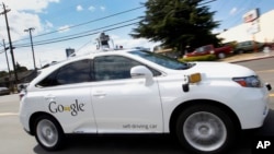 Google's self-driving Lexus car drives along street during a demonstration at Google campus on Wednesday, May 13, 2015, in Mountain View, Calif. (AP Photo/Tony Avelar)