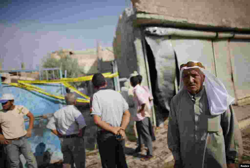 A man walks past the damaged house where five Turkish civilians were killed by a mortar bomb in the southern border town of Akcakale, Turkey, October 4, 2012.