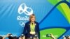 U.S. swimmer Katie Ledecky poses with her medals after her final news conference at the Rio Olympics Main press center, Rio de Janeiro, Aug. 13, 2016. (P. Brewer/VOA)