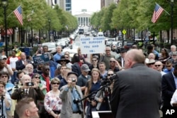 FILE - Supporters of House Bill 2 gather outside the North Carolina State Capitol in Raleigh, N.C., April 11, 2016.