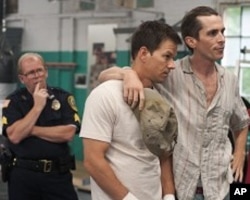 Left to right: Mickey O’Keefe plays himself, Mark Wahlberg plays Micky Ward, and Christian Bale plays Dicky Eklund in THE FIGHTER.
