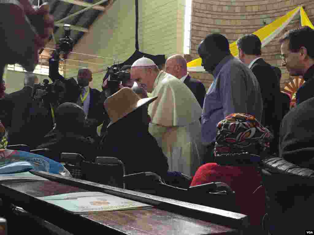 The Pope greeting people at St. Joseph the Worker Parish in Kangemi, Nov. 27, 2015. (J. Craig/VOA)