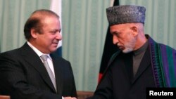 Afghan President Hamid Karzai (on right) and Pakistani Prime Minister Nawaz Sharif at a joint news conference in Kabul last month.